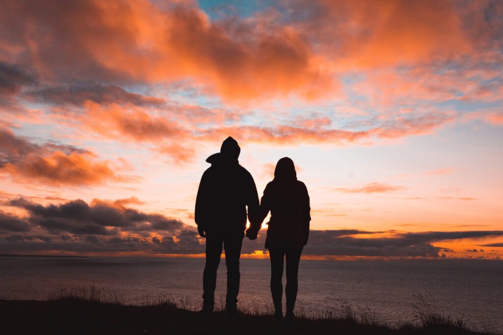 relationships and lockdown picture of silhouette of couple in a sunset