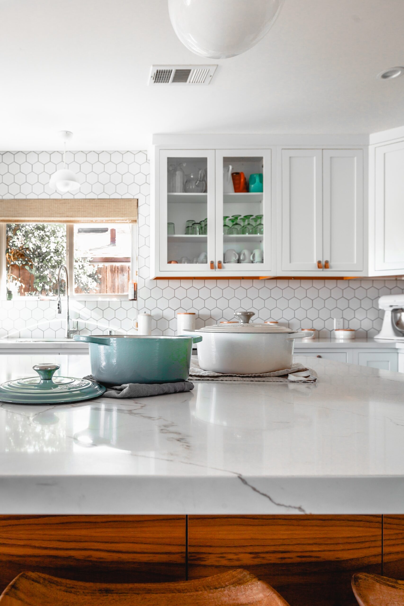 granite countertop with cooking pots on it