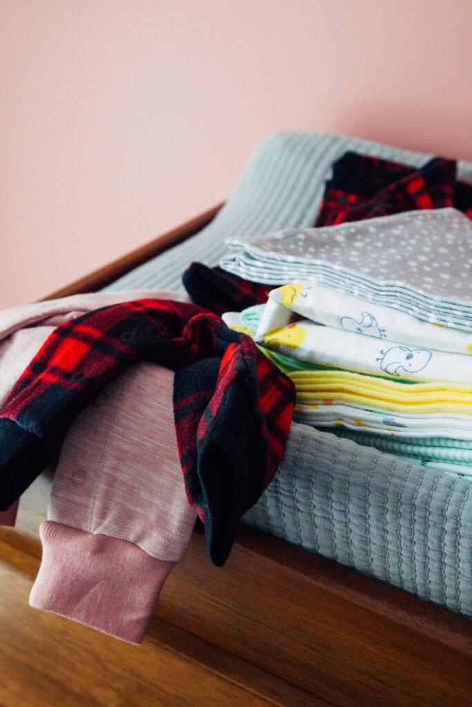 pile of baby clothes