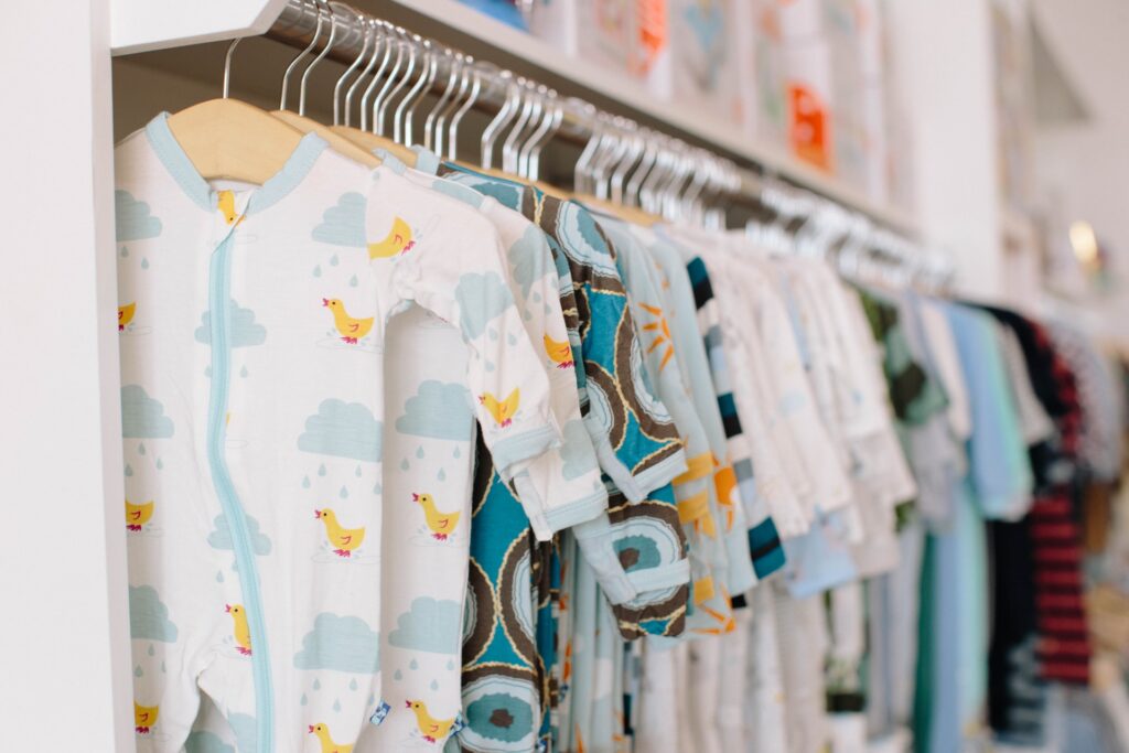 baby clothes hung up on a rail