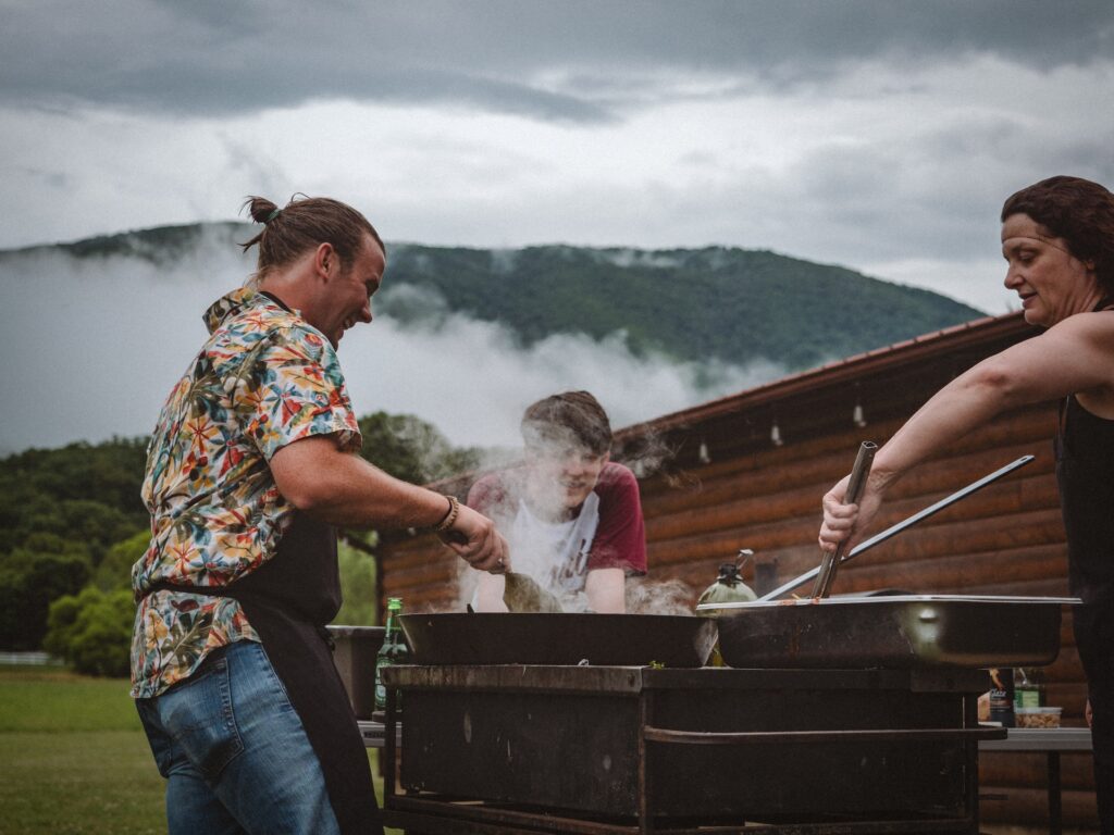 people cooking on a barbecue
