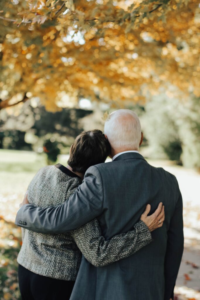 couple cuddling on a bench