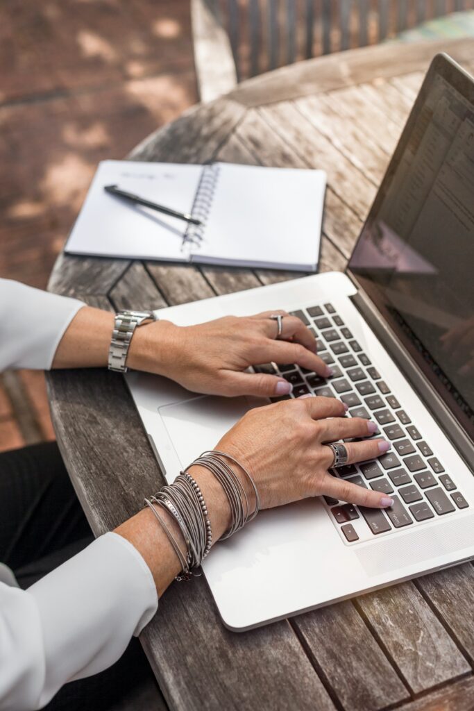woman's hands typing