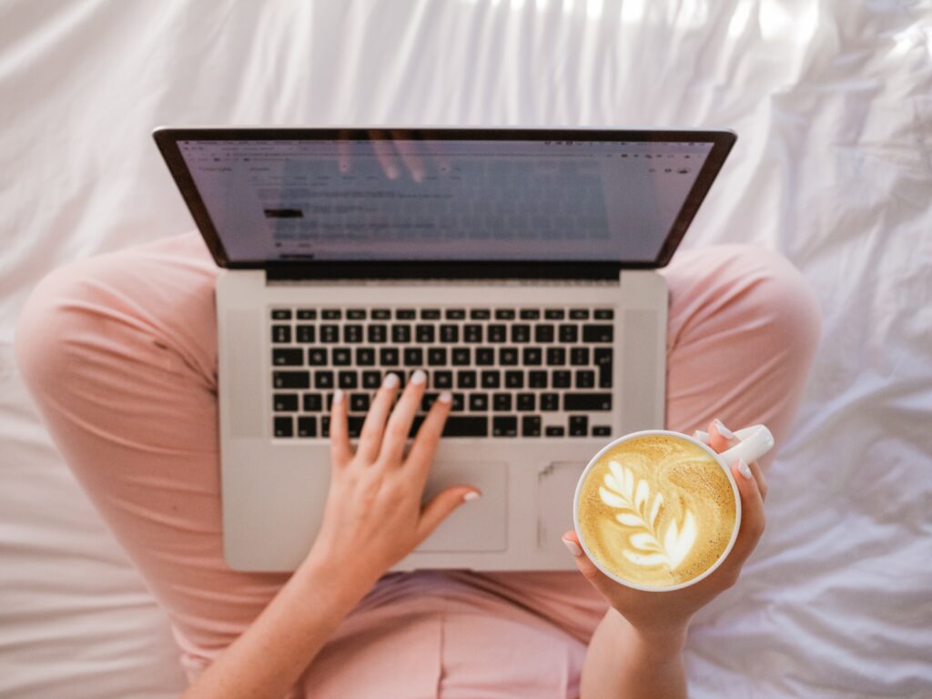 someone typing on a laptop
