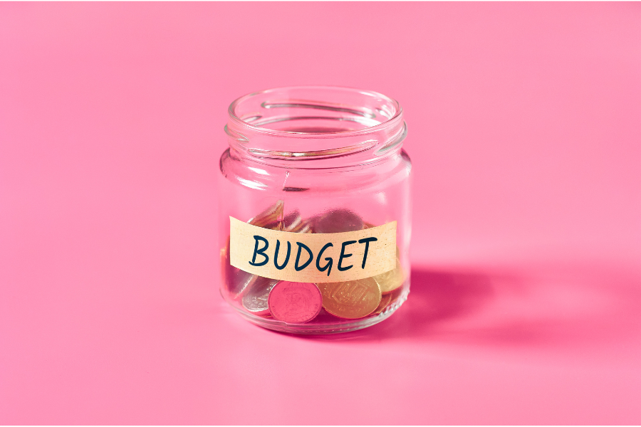 jar full of money with the word budget written on it