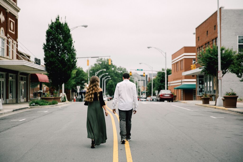 couple walking and woman wearing long dress