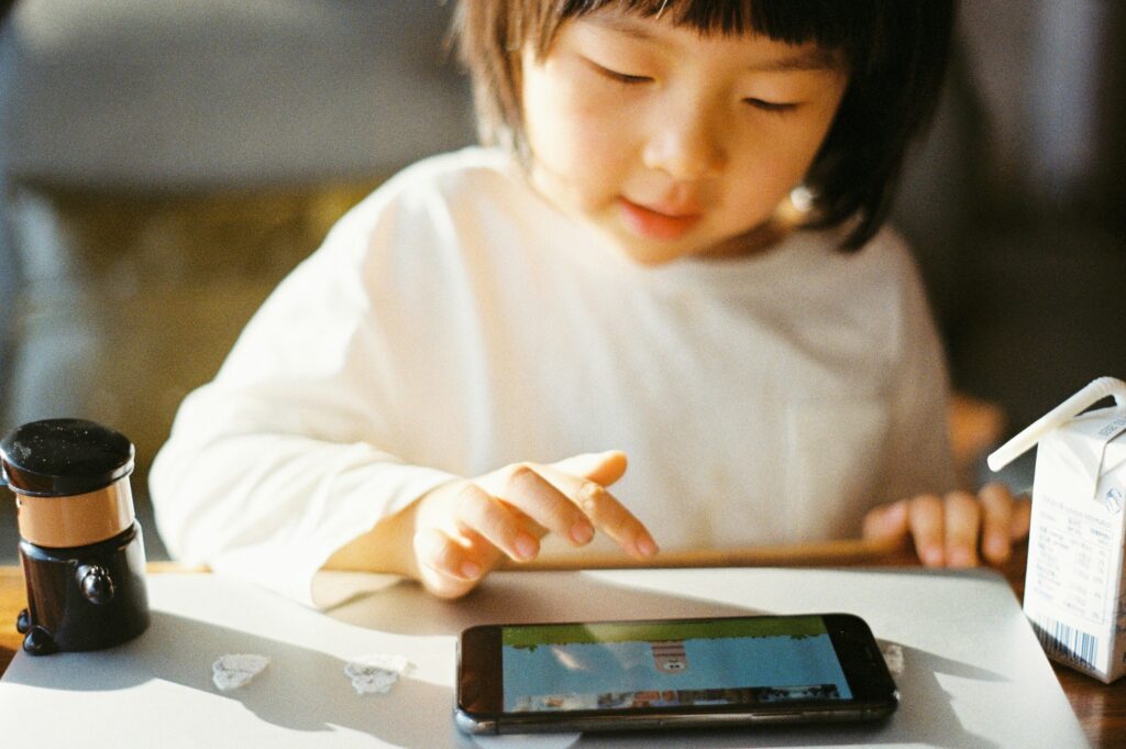 child playing on a tablet