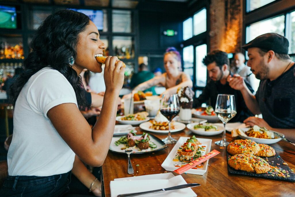 woman enjoying food at a restaurant